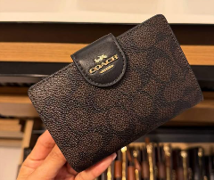 Coach Medium Corner Zip Wallet in signature canvas
